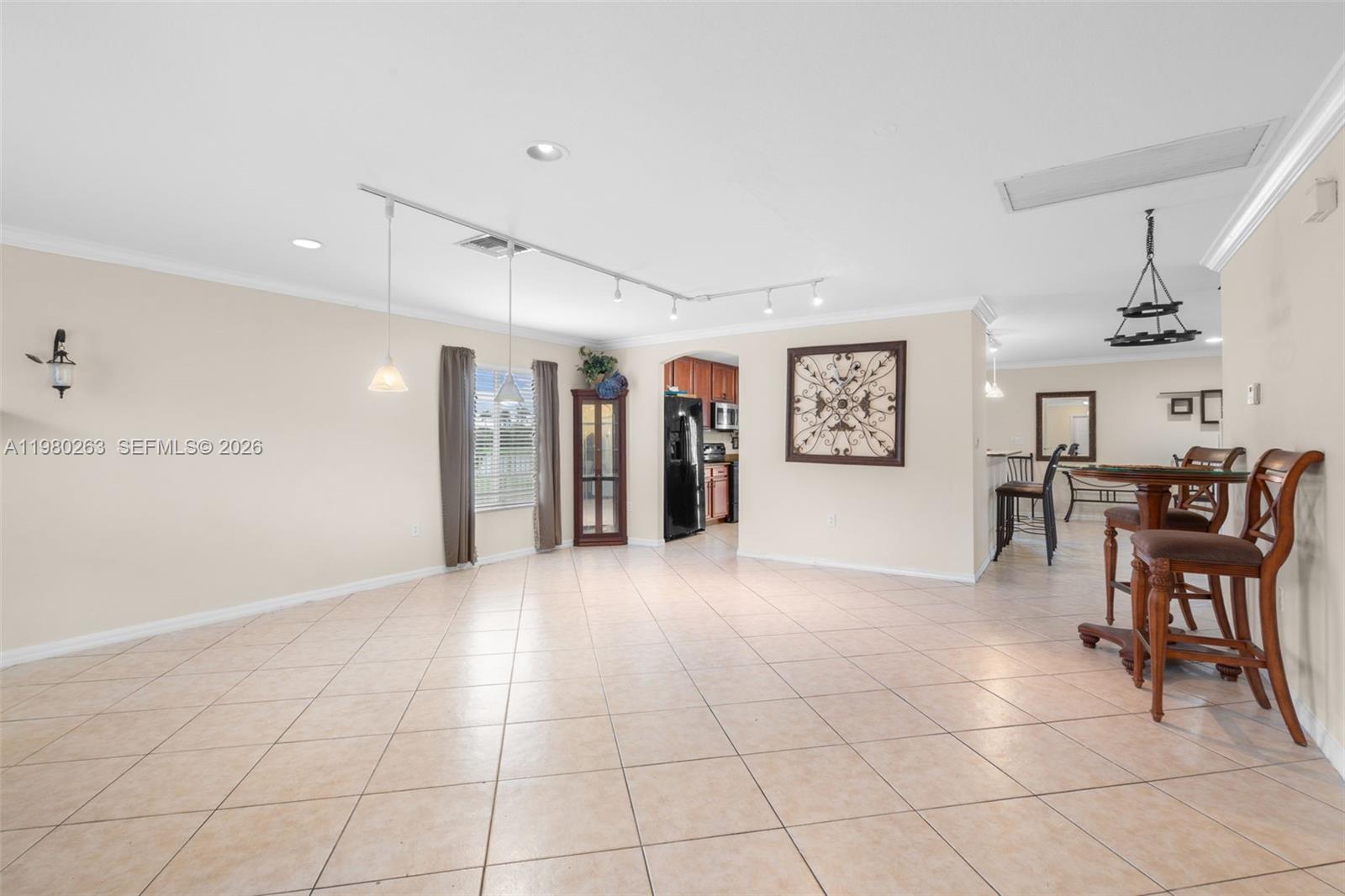 4628 Southwest 129th Avenue Miramar, FL 33027 - Photo 10 of 36 a view of a livingroom with furniture and lots of furniture