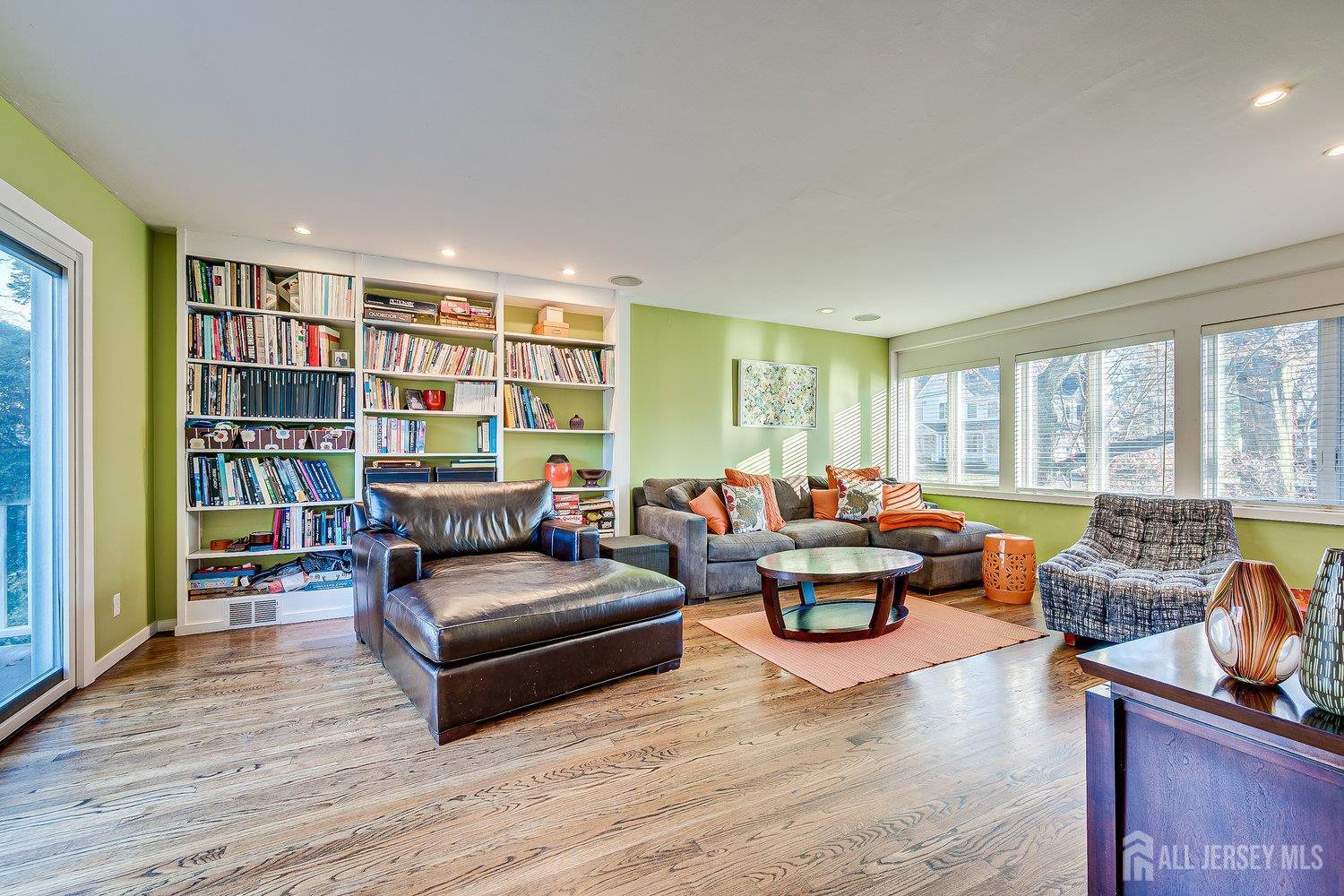 62 Spring Street Metuchen, NJ 08840 - Photo 17 of 47 a living room with furniture and a book shelf