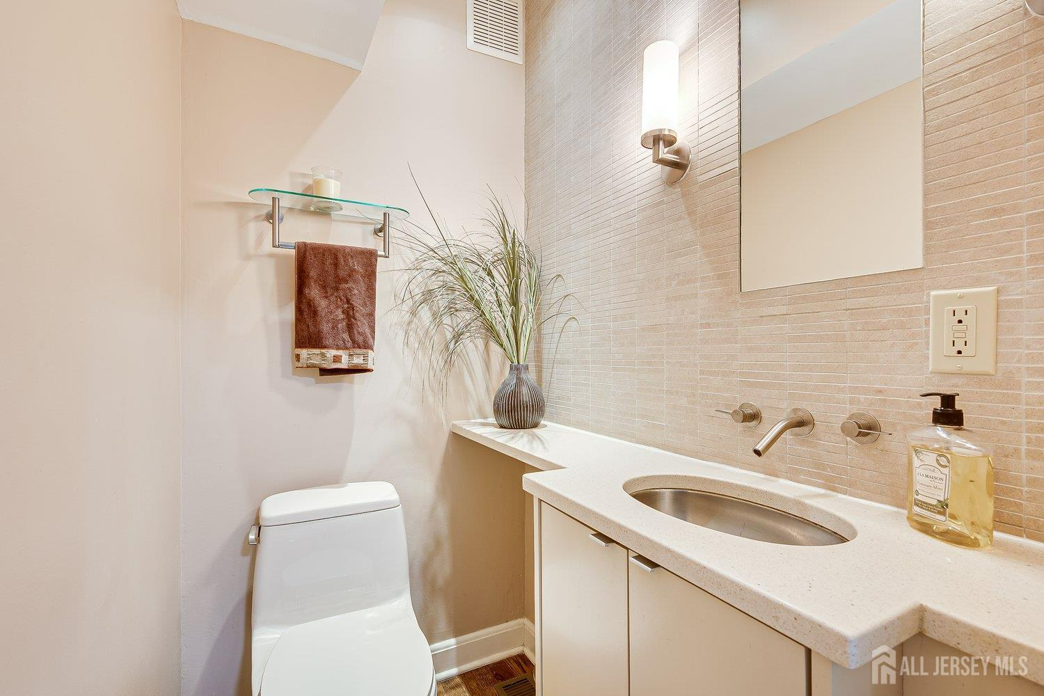 62 Spring Street Metuchen, NJ 08840 - Photo 25 of 47 a bathroom with a sink toilet and vanity