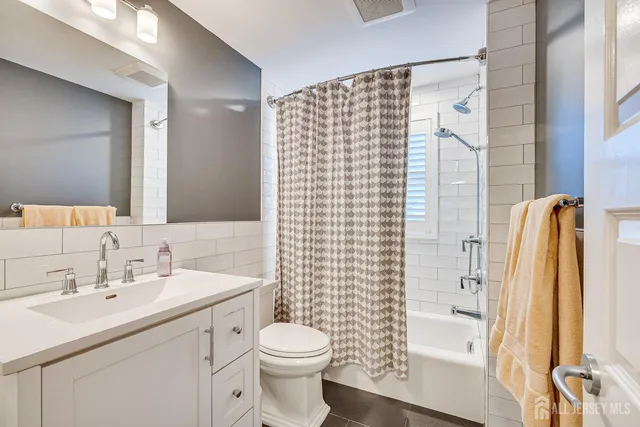 a bedroom with furniture and a wooden floor