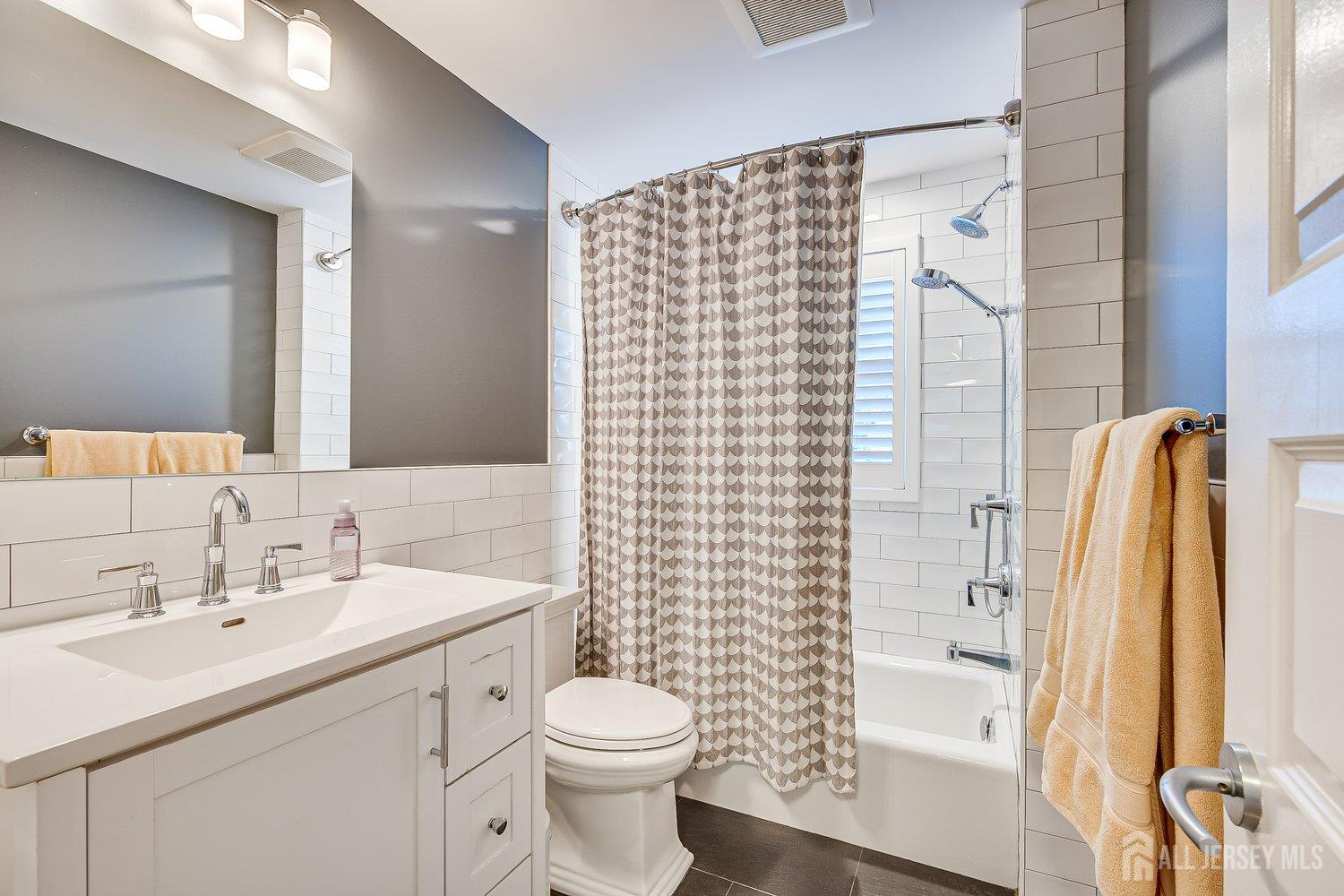 62 Spring Street Metuchen, NJ 08840 - Photo 31 of 47 a bathroom with a sink toilet and shower