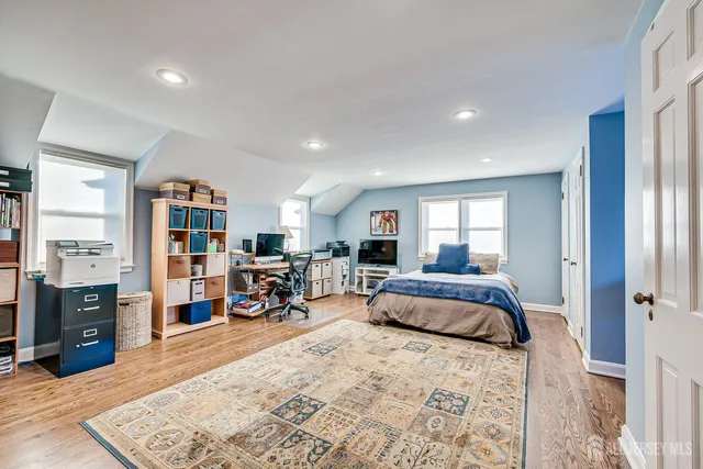 a bed room with a bed and a book shelf