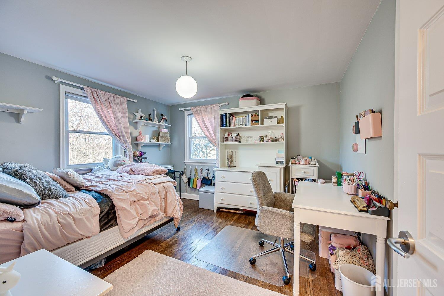 62 Spring Street Metuchen, NJ 08840 - Photo 33 of 47 a bedroom with furniture and a wooden floor