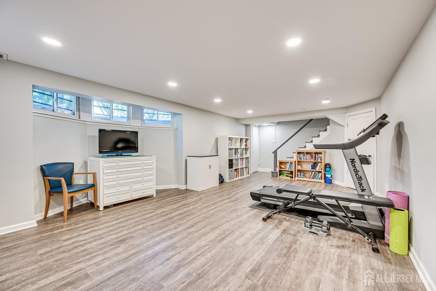 62 Spring Street Metuchen, NJ 08840 - Photo 35 of 47 a room with wooden floor and gym equipment