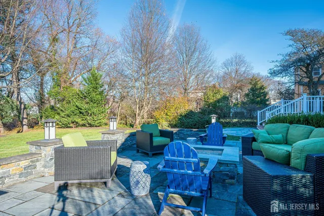 a view of a chairs and table on the wooden deck