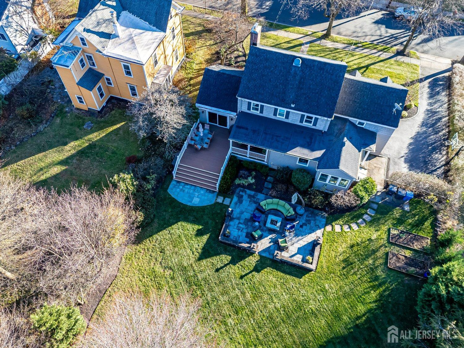 62 Spring Street Metuchen, NJ 08840 - Photo 43 of 47 a aerial view of a house with a yard basket ball court and outdoor seating