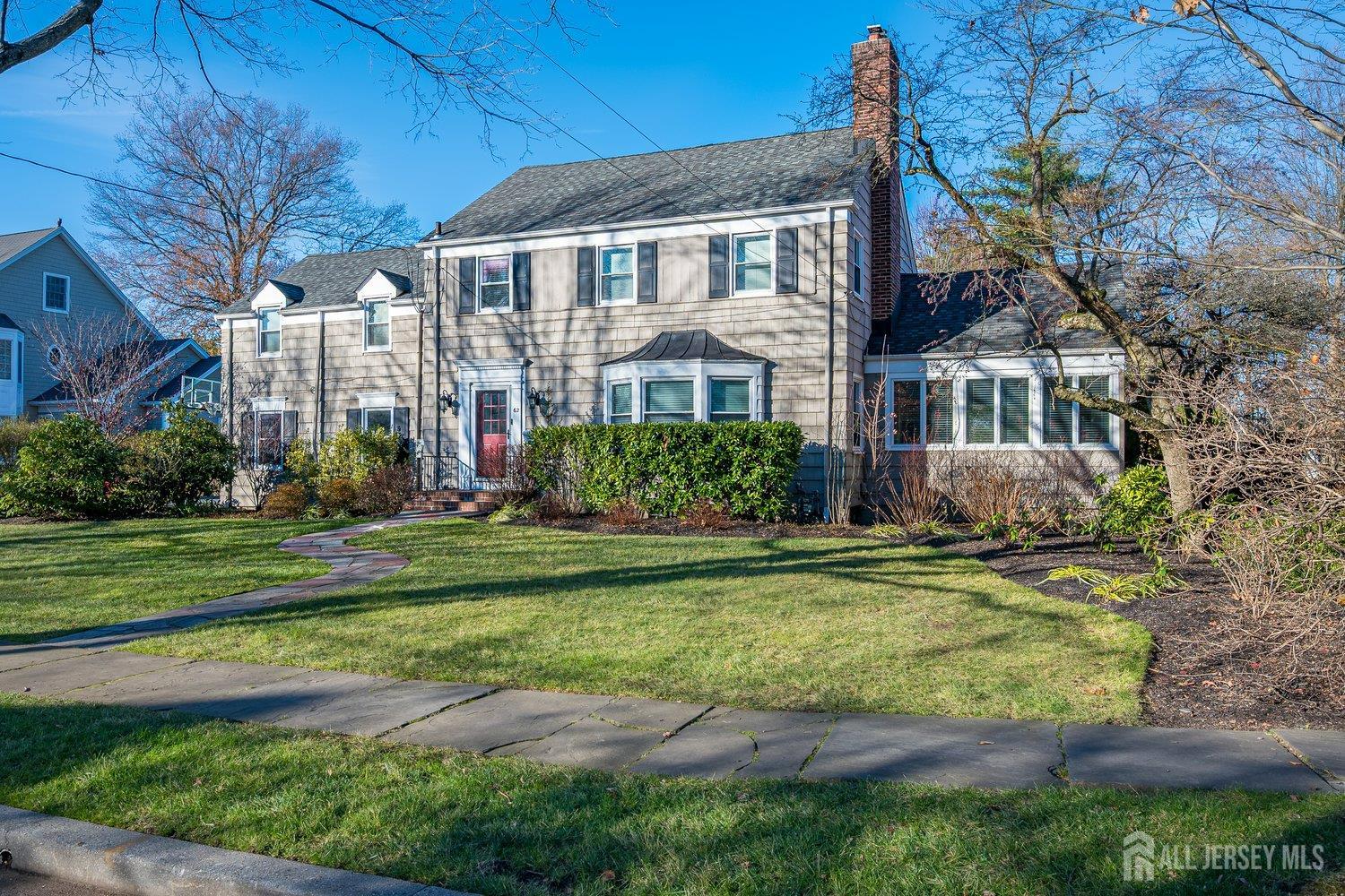 62 Spring Street Metuchen, NJ 08840 - Photo 7 of 47 a front view of residential houses with yard and green space