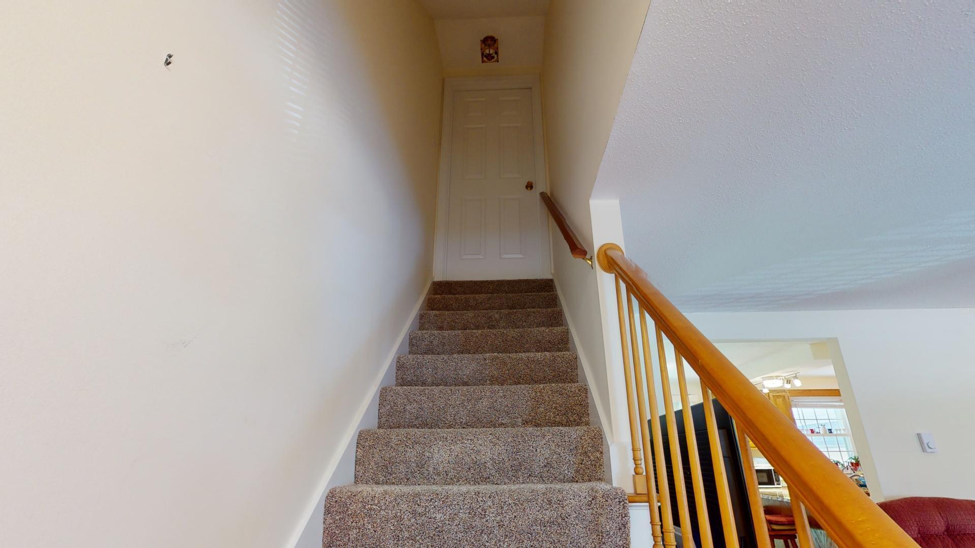 149 Flintlock Village, Unit 3 Wells, ME 04090 - Photo 16 of 24 Carpeted Stairs