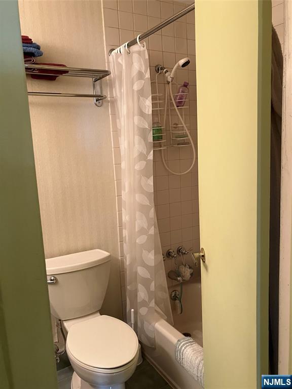 280 Prospect Avenue, Unit 11H Hackensack, NJ 07601 - Photo 14 of 20 a white toilet sitting next to a shower