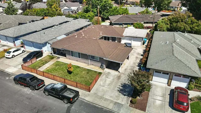an aerial view of residential house with outdoor space and parking
