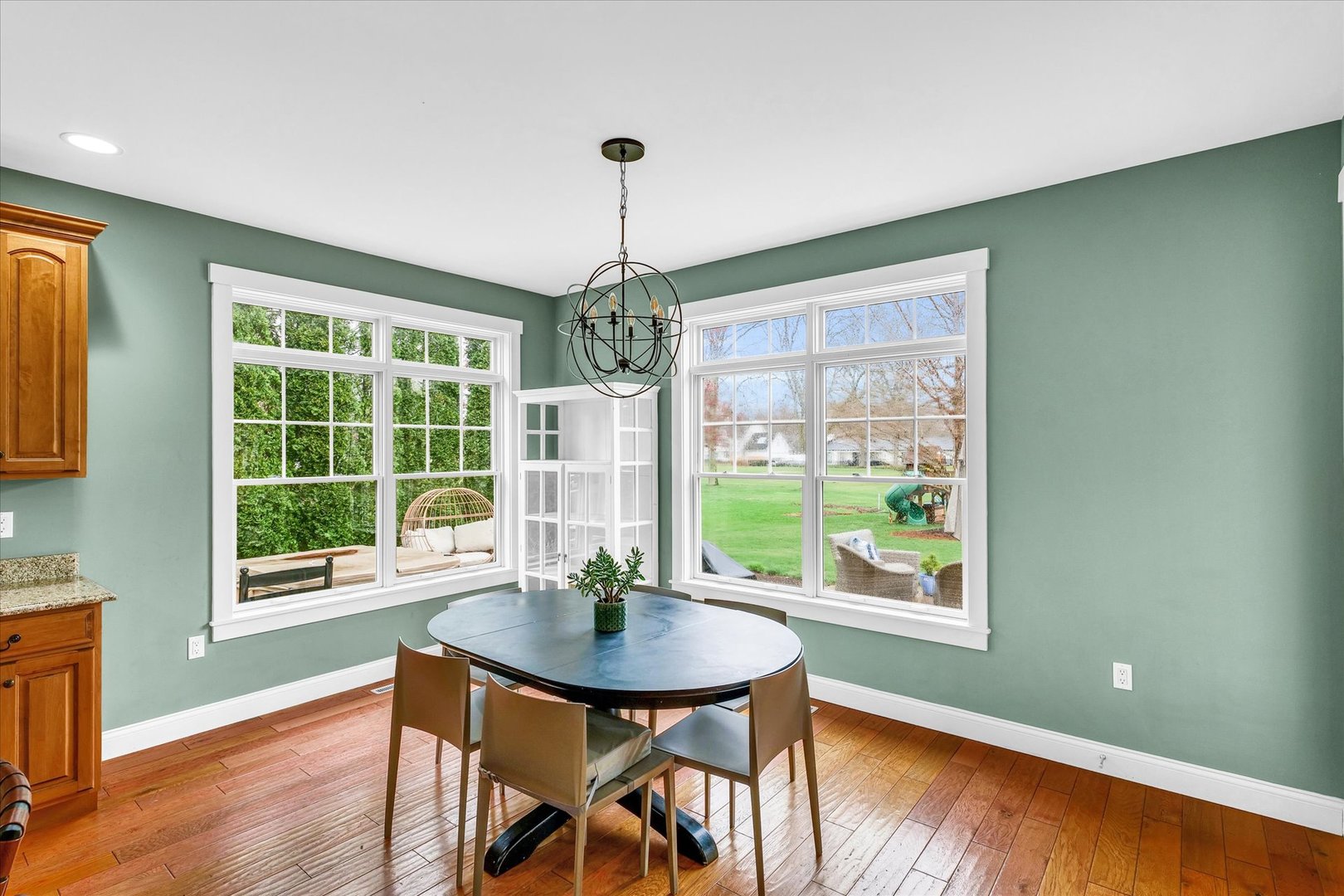 1803 Cobblefield Court Champaign, IL 61822 - Photo 15 of 55 a view of a dining room with furniture window and wooden floor