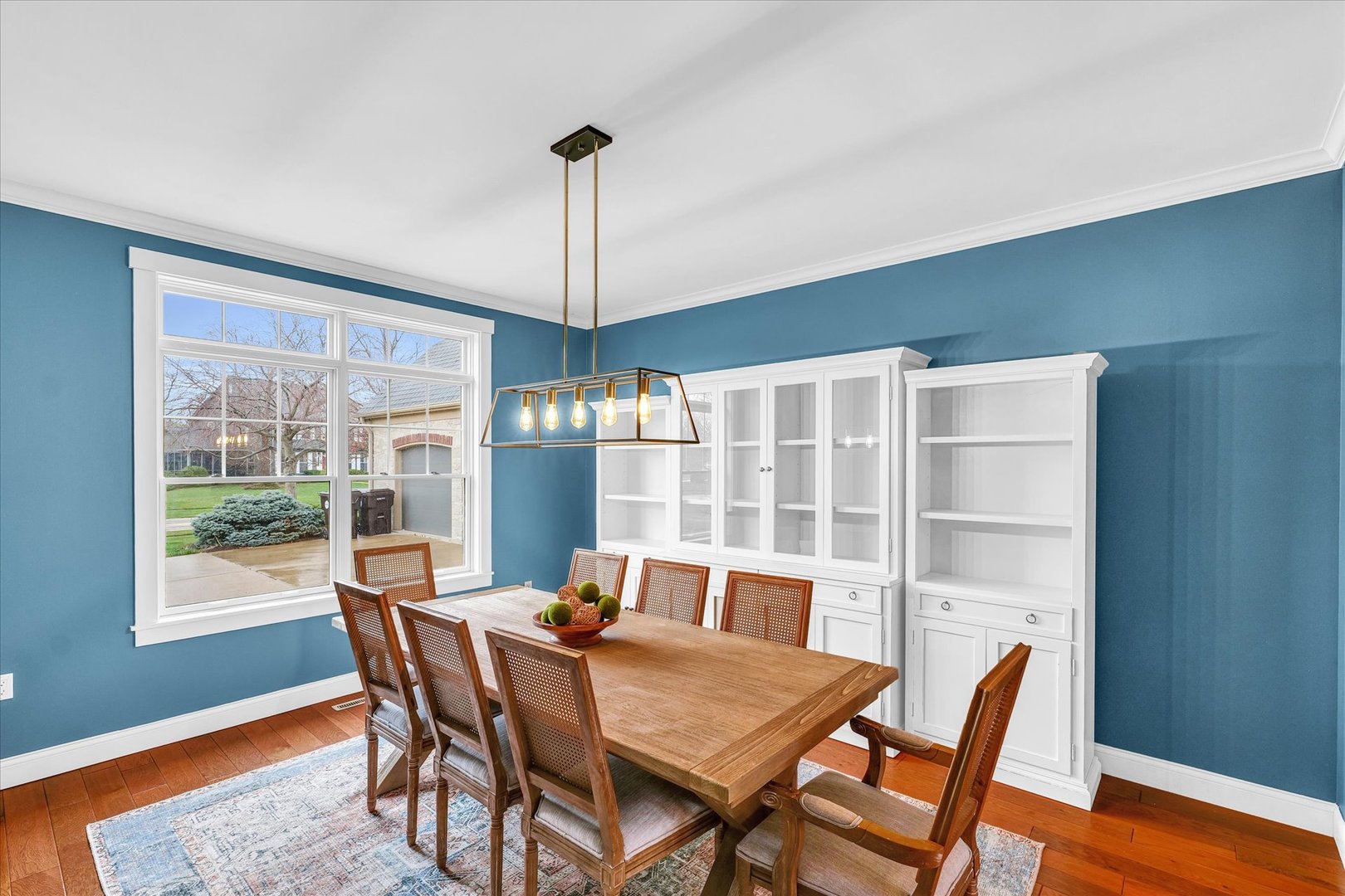 1803 Cobblefield Court Champaign, IL 61822 - Photo 16 of 55 a view of a dining room with furniture window and wooden floor