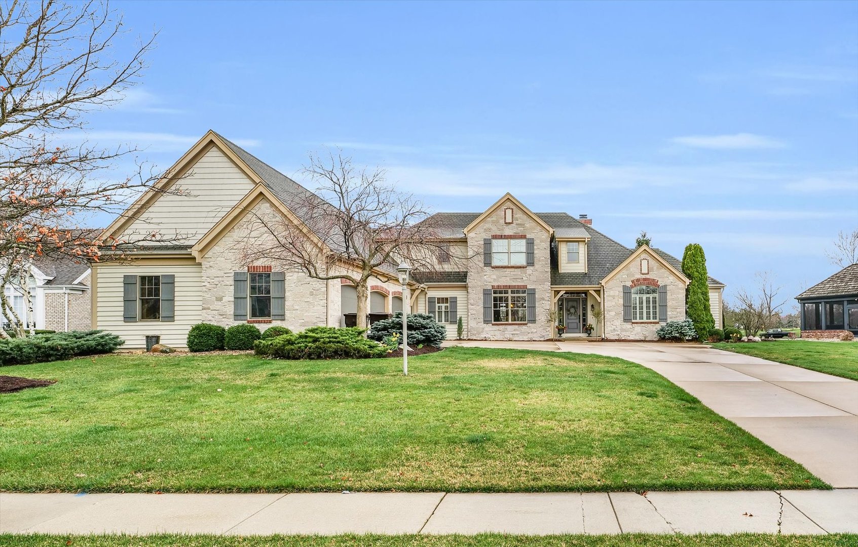1803 Cobblefield Court Champaign, IL 61822 - Photo 2 of 55 a front view of a house with a yard