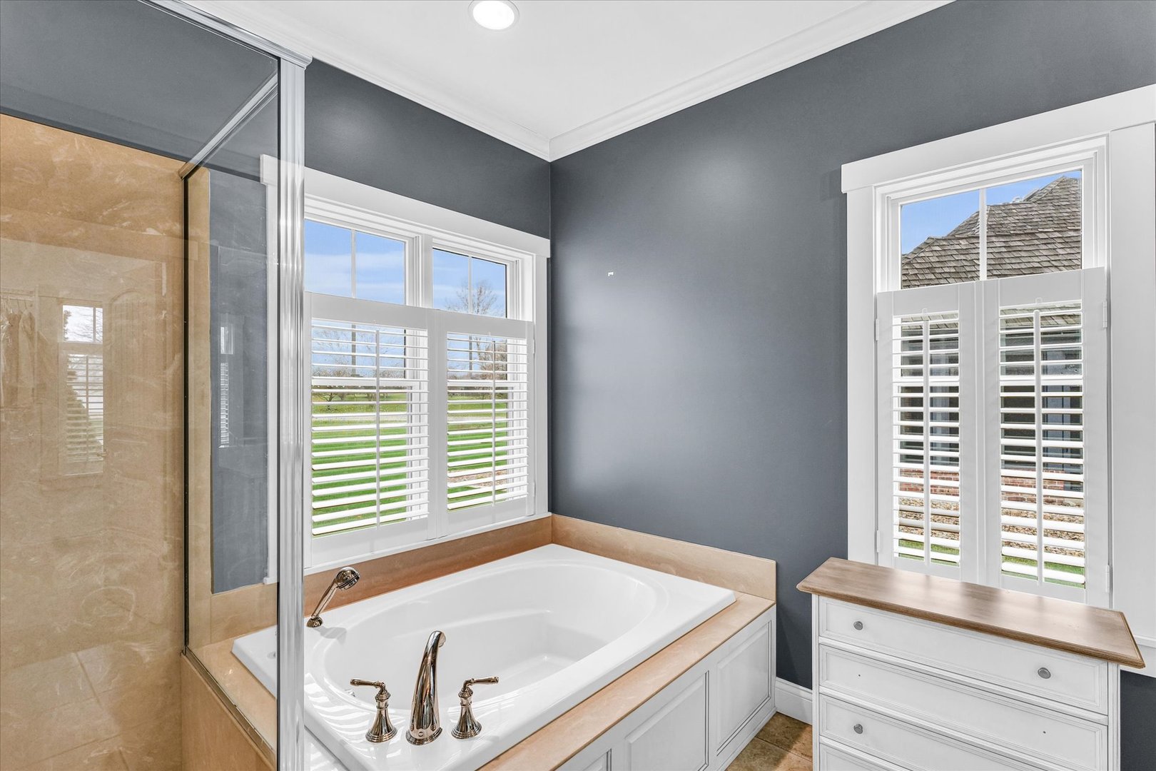 1803 Cobblefield Court Champaign, IL 61822 - Photo 22 of 55 a bathroom with a tub and a window