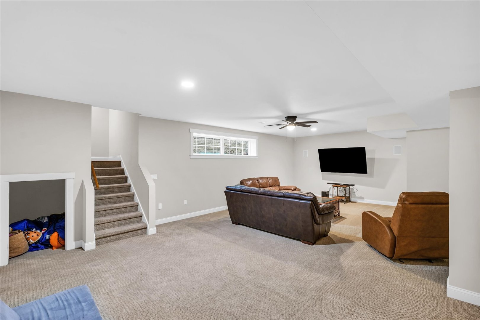 1803 Cobblefield Court Champaign, IL 61822 - Photo 38 of 55 a living room with furniture and a flat screen tv