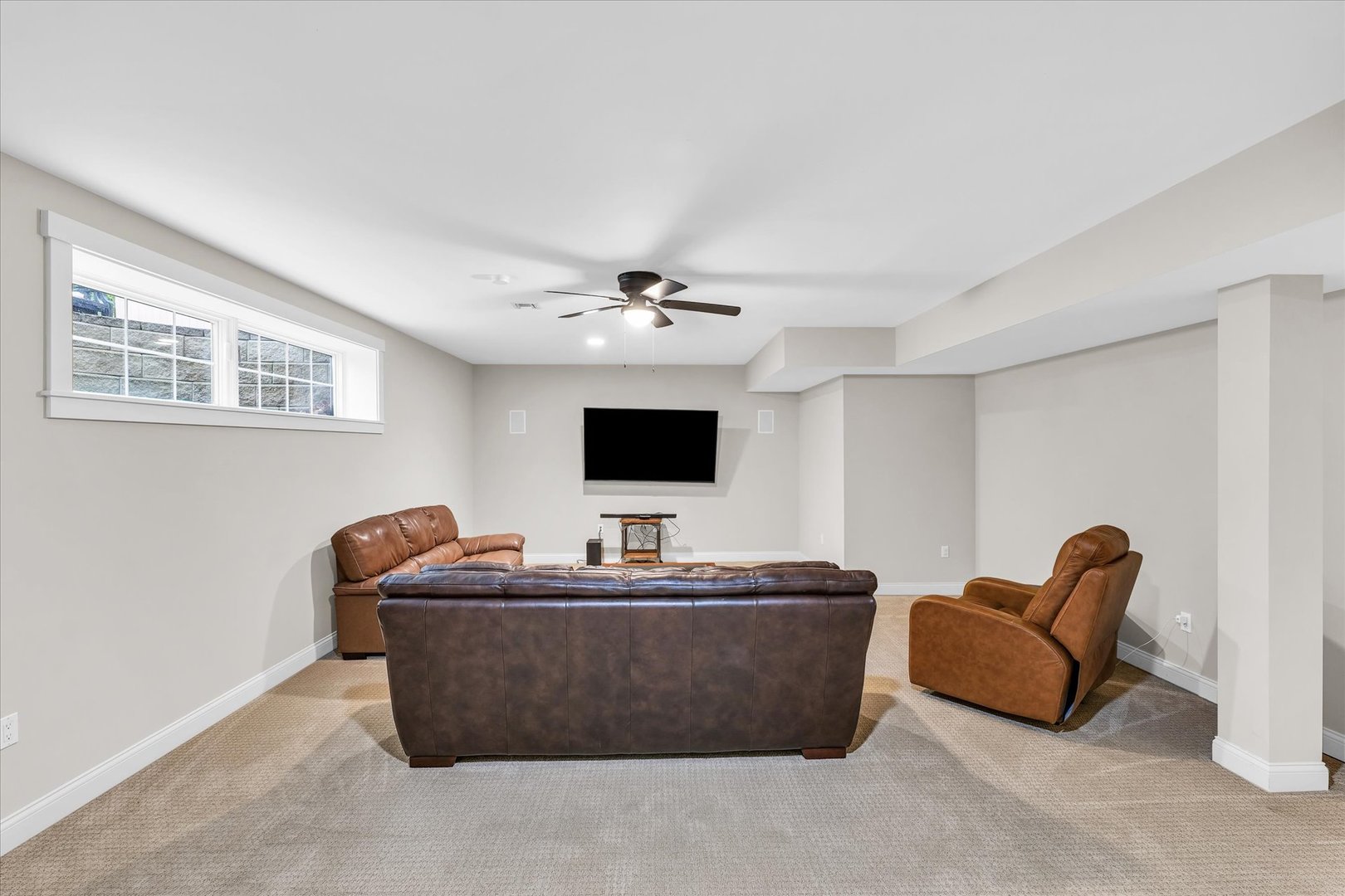 1803 Cobblefield Court Champaign, IL 61822 - Photo 40 of 55 a living room with furniture and a flat screen tv