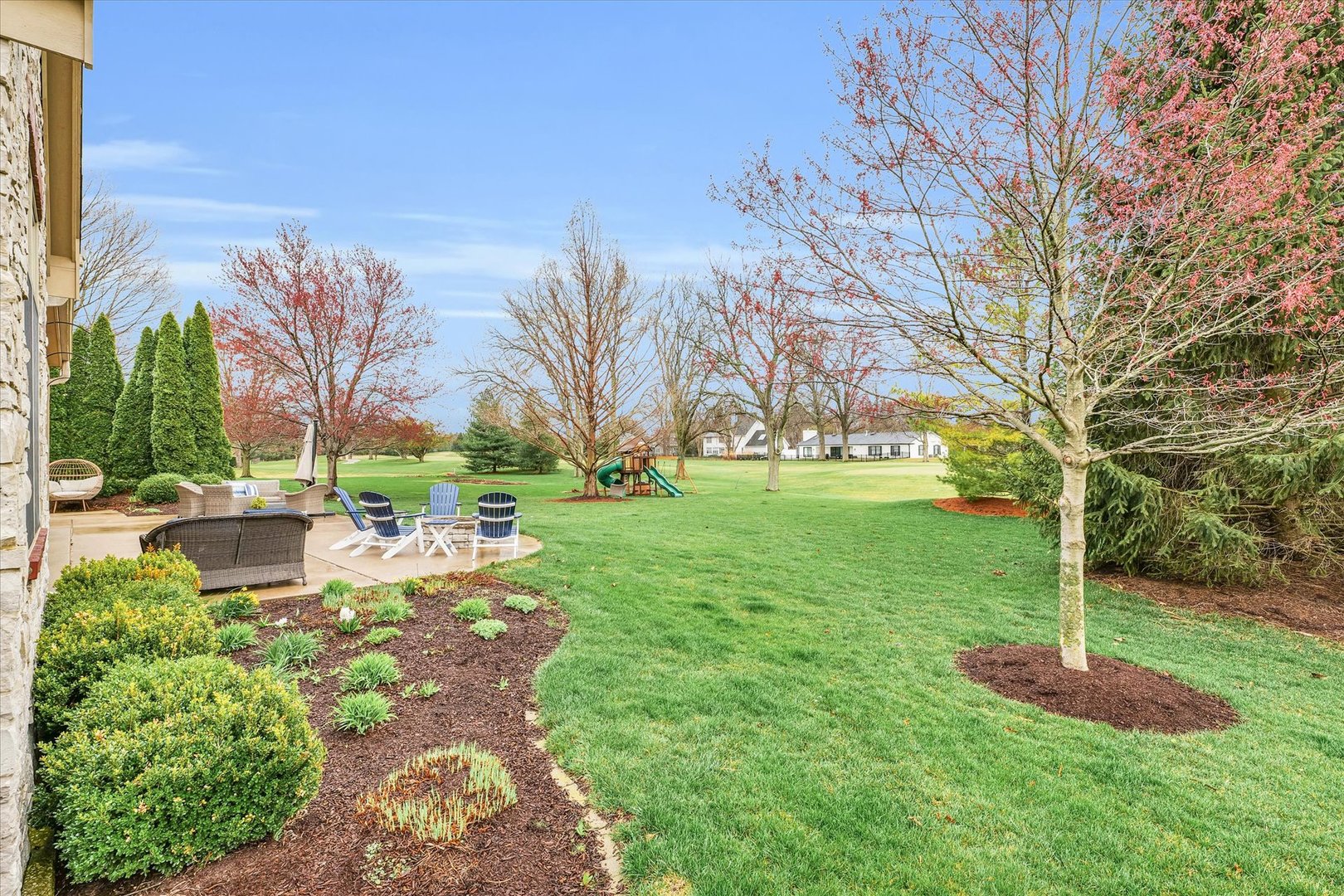 1803 Cobblefield Court Champaign, IL 61822 - Photo 48 of 55 a backyard of a house with lots of green space