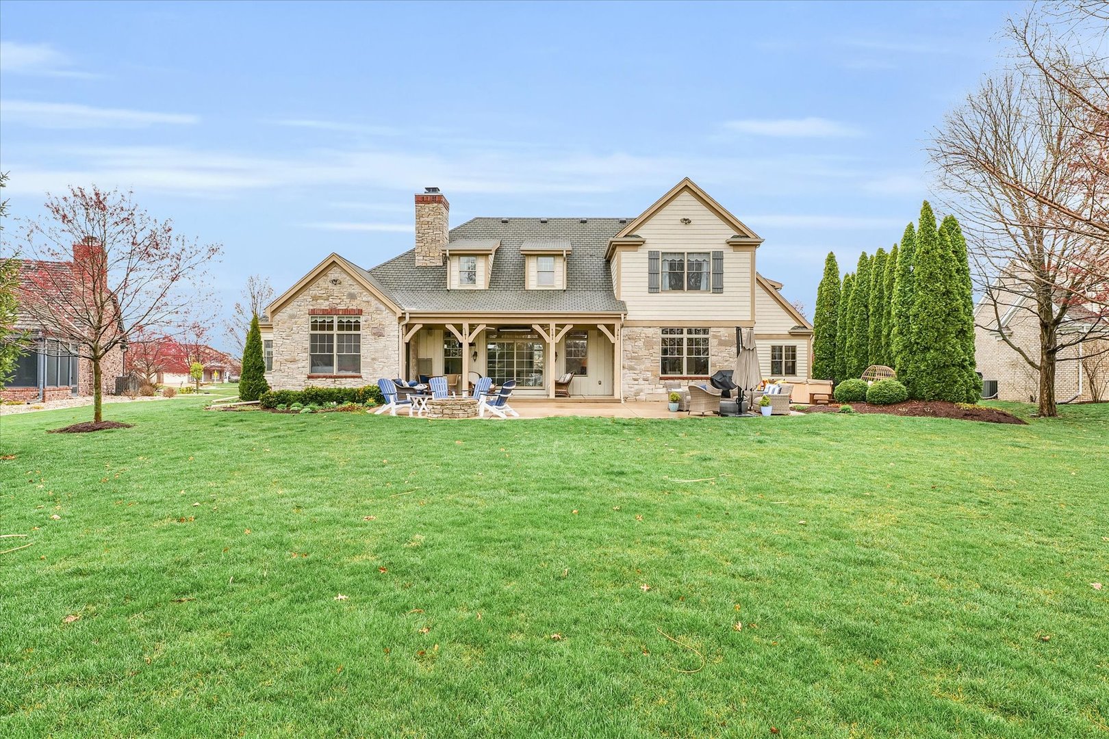 1803 Cobblefield Court Champaign, IL 61822 - Photo 49 of 55 a front view of a house with a yard and trees