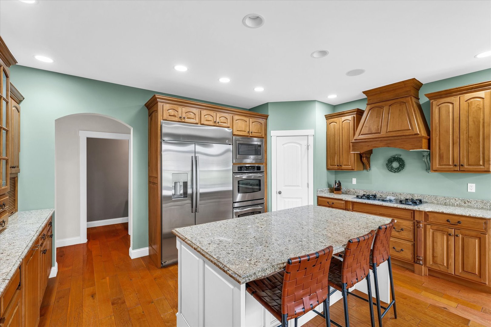 1803 Cobblefield Court Champaign, IL 61822 - Photo 10 of 55 a kitchen with stainless steel appliances granite countertop a sink and cabinets