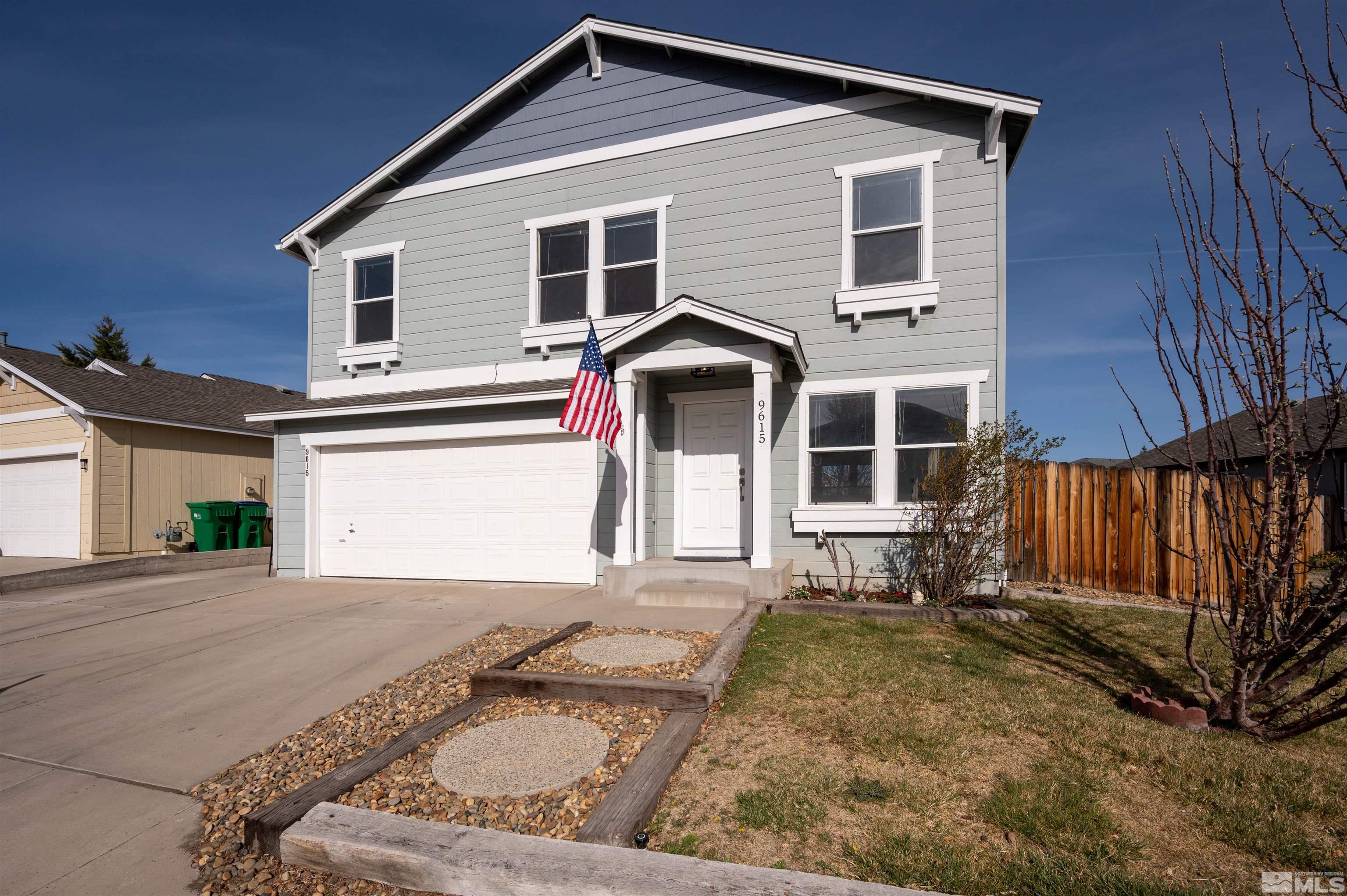 9615 Autumn Leaf Way Reno, NV 89506 - Photo 1 of 24 a front view of a house with a yard
