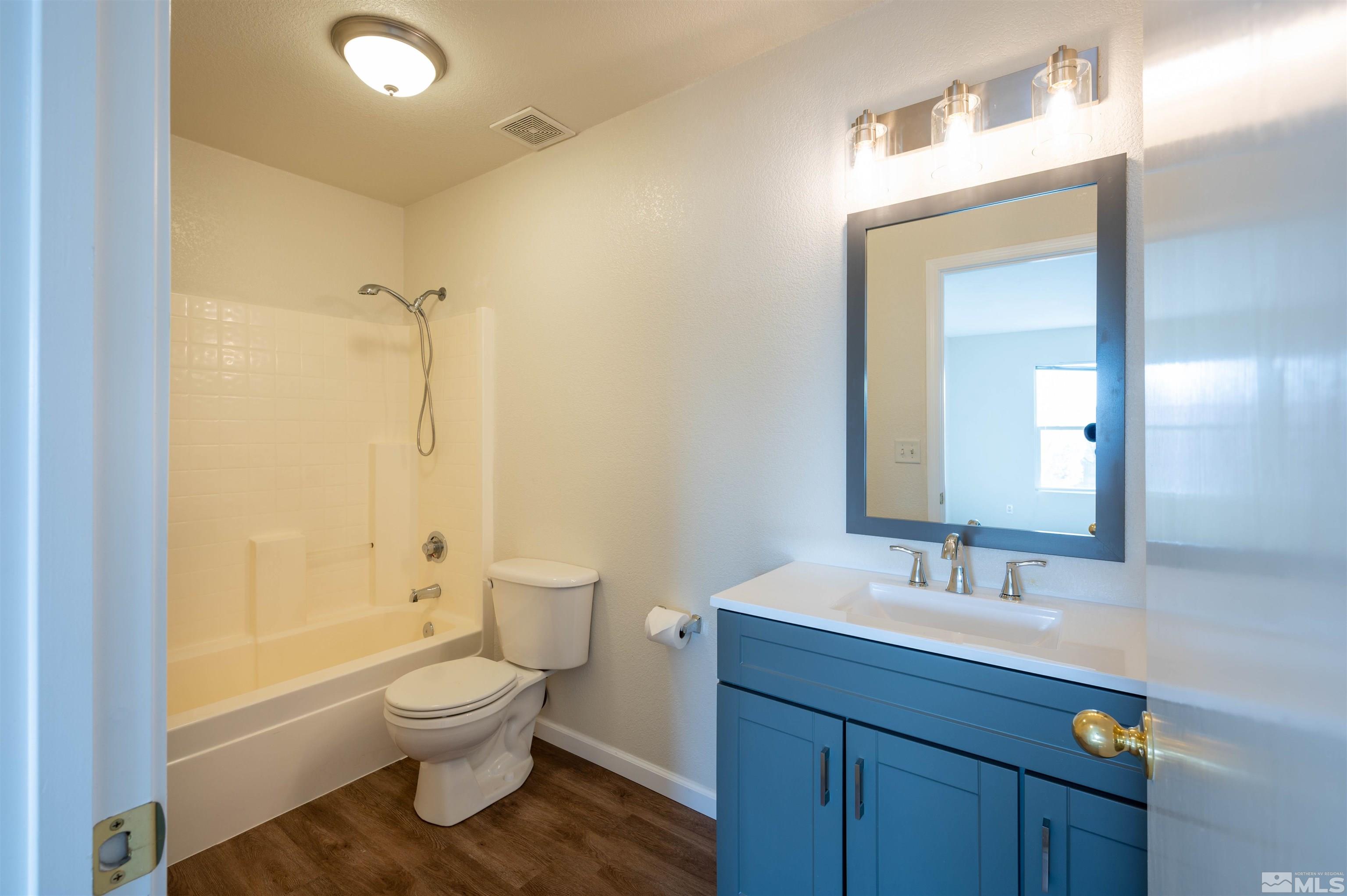 9615 Autumn Leaf Way Reno, NV 89506 - Photo 12 of 24 a bathroom with a sink a toilet and shower