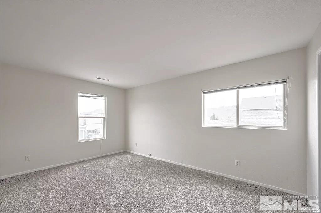 9615 Autumn Leaf Way Reno, NV 89506 - Photo 14 of 24 an empty room with windows
