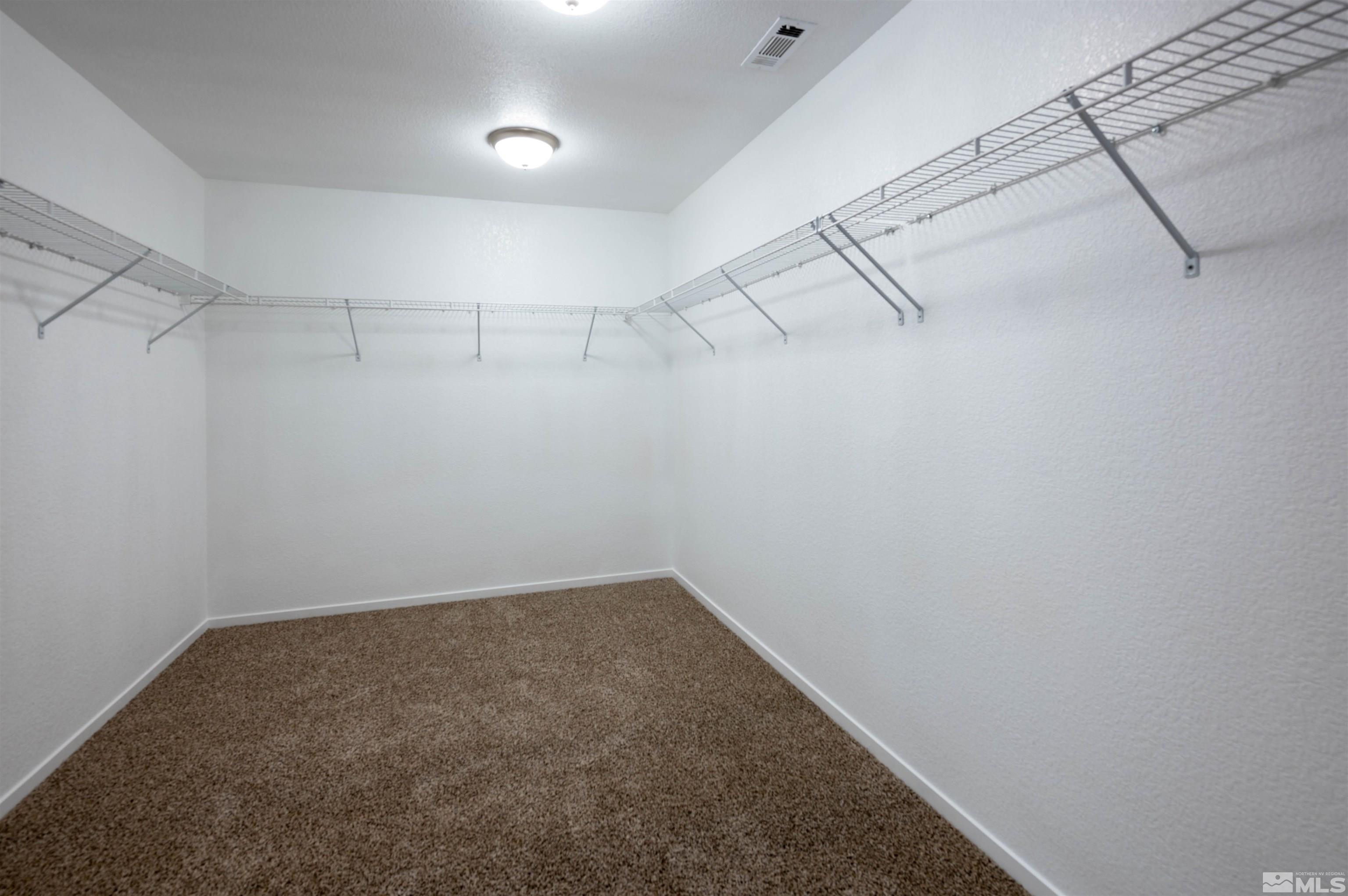 9615 Autumn Leaf Way Reno, NV 89506 - Photo 19 of 24 a view of a room with racks on the wall