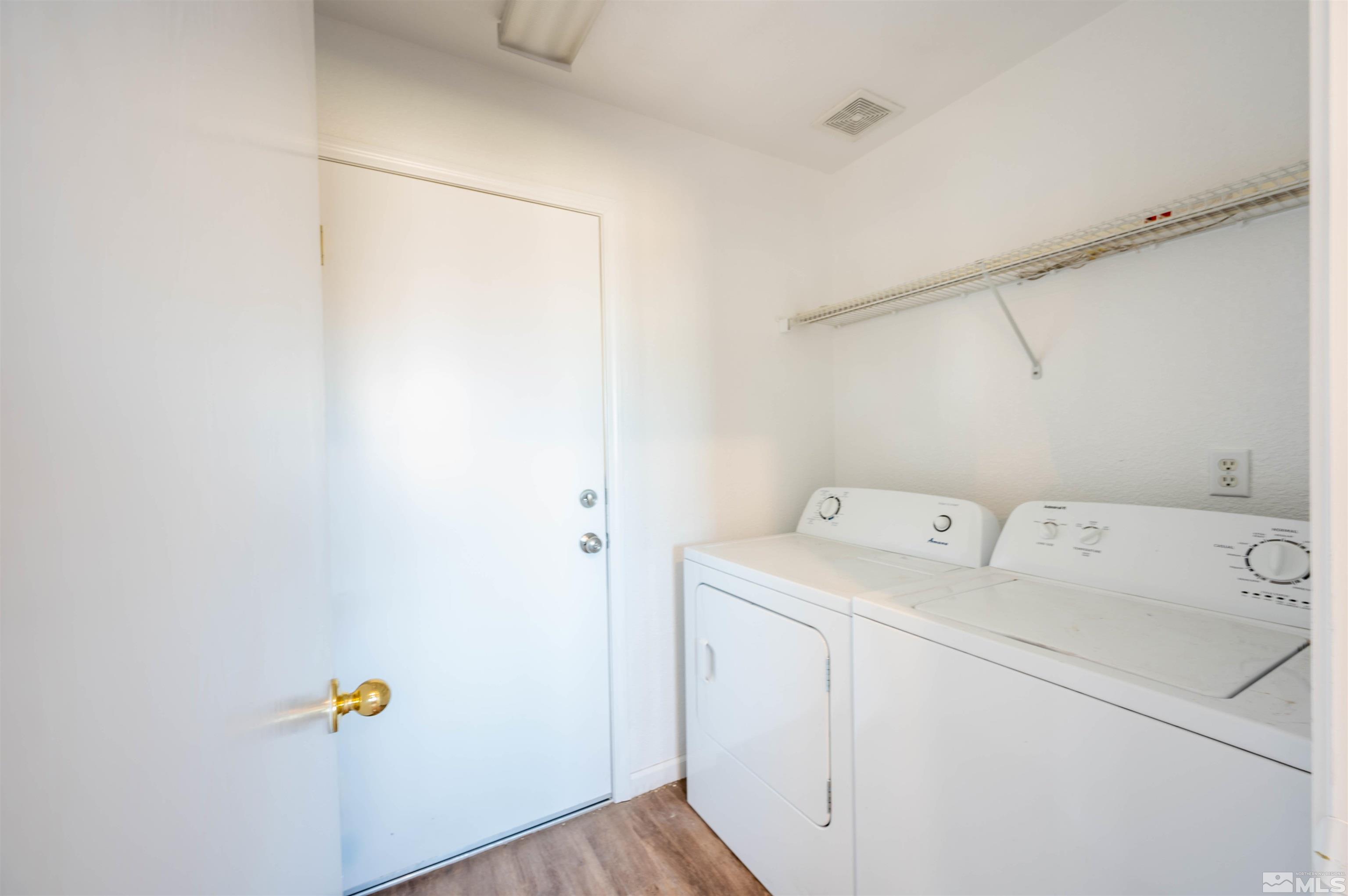 9615 Autumn Leaf Way Reno, NV 89506 - Photo 20 of 24 a utility room with dryer and washer