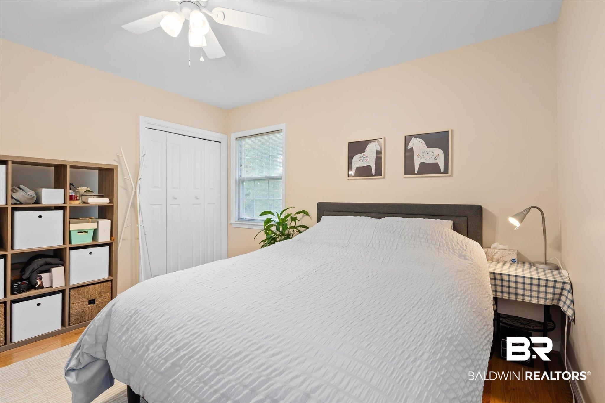 162 Bit And Spur Terrace Mobile, AL 36608 - Photo 17 of 29 Bedroom featuring hardwood / wood-style flooring, a closet, and ceiling fan