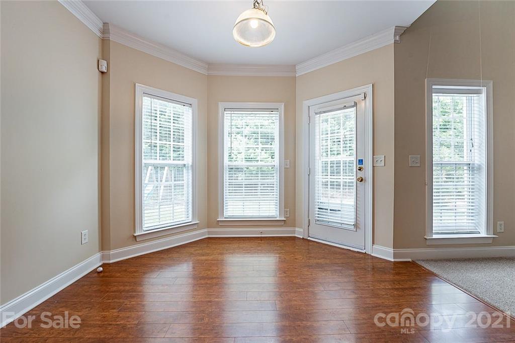 3546 Weddington Ridge Lane Matthews, NC 28105 - Photo 12 of 24 a view of empty room with wooden floor and fan