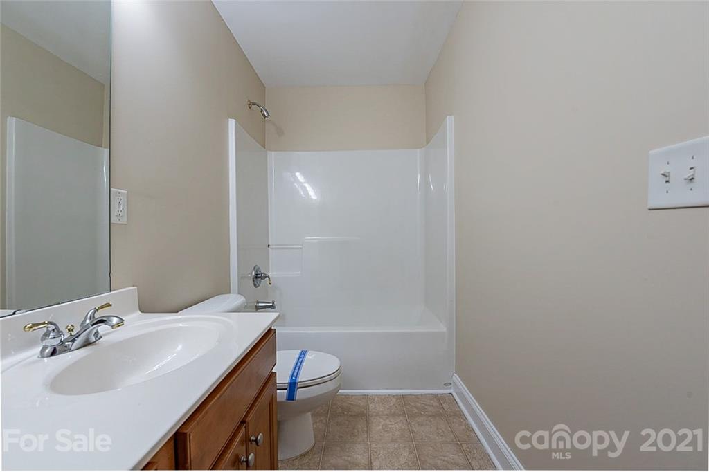 3546 Weddington Ridge Lane Matthews, NC 28105 - Photo 19 of 24 a bathroom with a sink a toilet and shower
