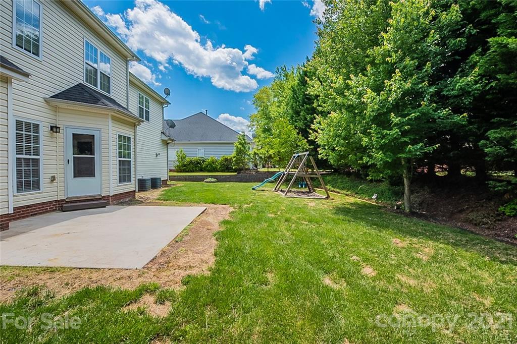 3546 Weddington Ridge Lane Matthews, NC 28105 - Photo 21 of 24 a view of a house with a yard