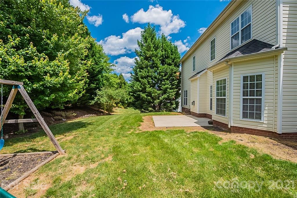 3546 Weddington Ridge Lane Matthews, NC 28105 - Photo 22 of 24 a view of a house with a backyard