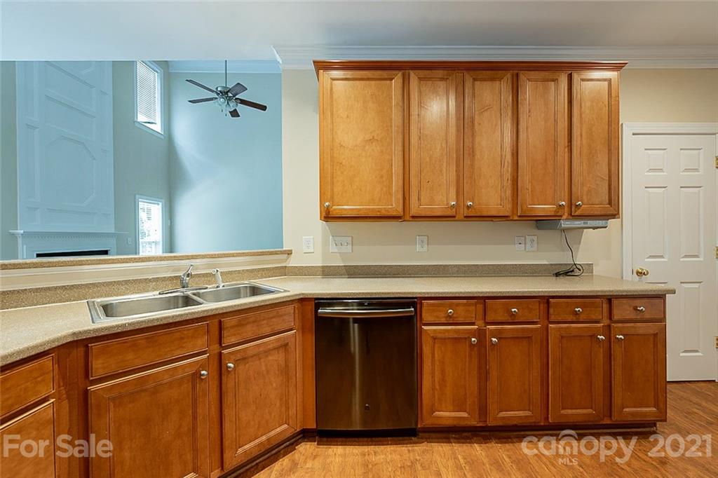 3546 Weddington Ridge Lane Matthews, NC 28105 - Photo 8 of 24 a kitchen with a sink and cabinets