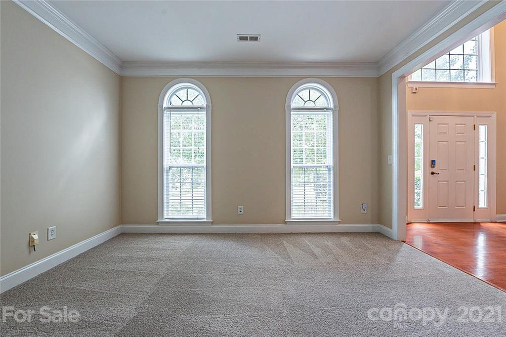 3546 Weddington Ridge Lane Matthews, NC 28105 - Photo 9 of 24 an empty room with windows mirror and windows