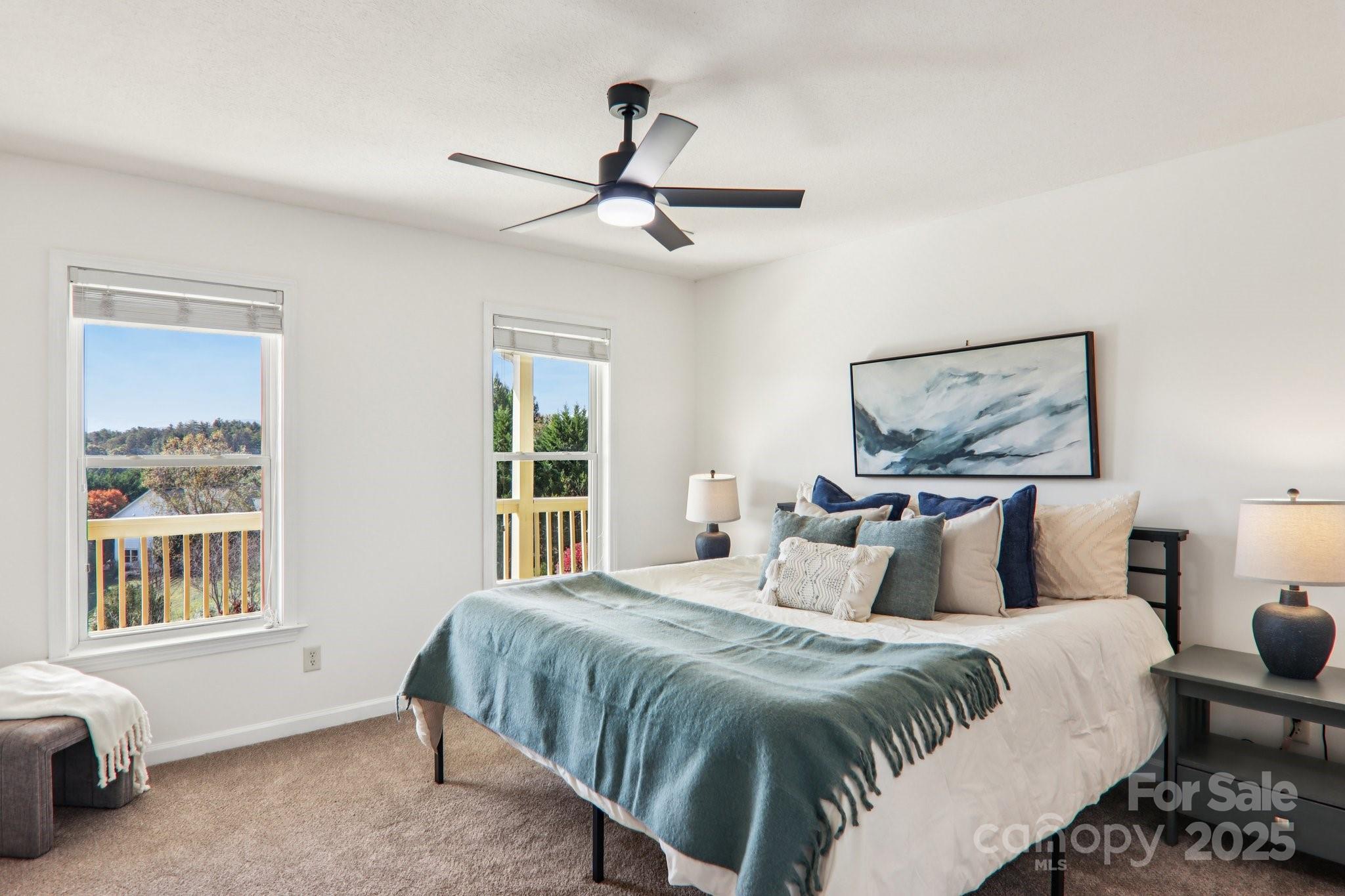136 Ridge Brook Drive Weaverville, NC 28787 - Photo 19 of 41 a bedroom with a large bed and a window