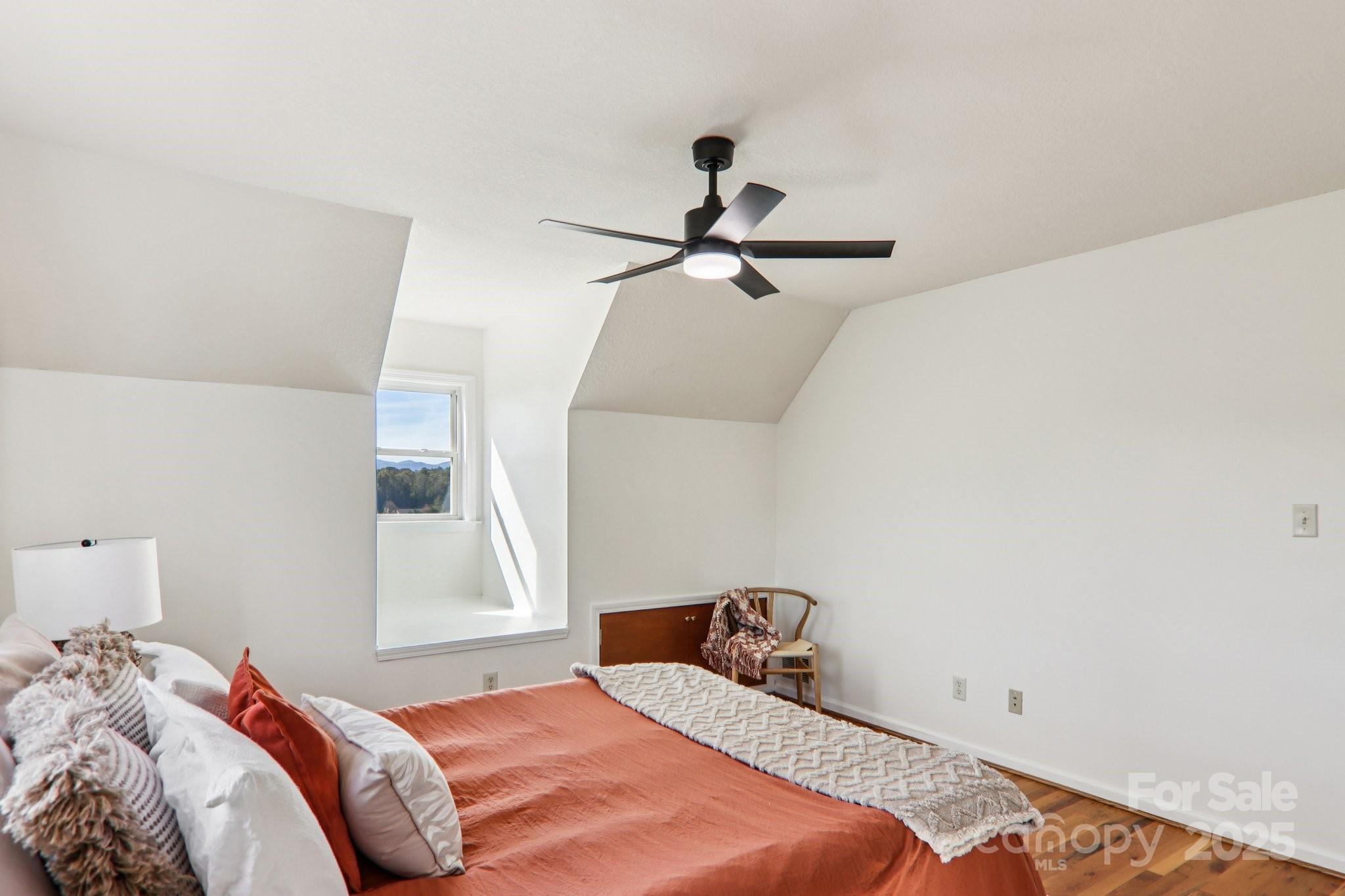136 Ridge Brook Drive Weaverville, NC 28787 - Photo 26 of 41 a bedroom with a bed and a window