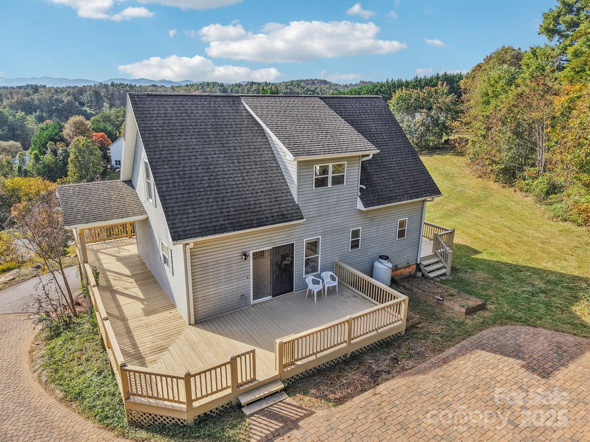 136 Ridge Brook Drive Weaverville, NC 28787 - Photo 3 of 41 an aerial view of a house with terrace