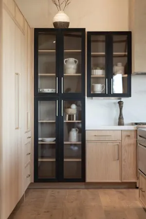 a kitchen with a refrigerator and a sink