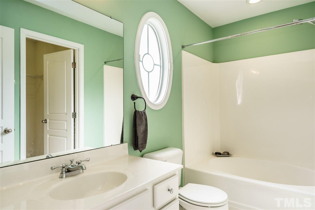 7822 Spungold Street Raleigh, NC 27617 - Photo 14 of 25 with a large walk-in closet.