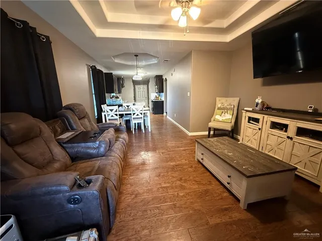 a backyard of a house with dishwasher and wooden fence