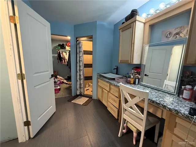 a kitchen with sink refrigerator and window