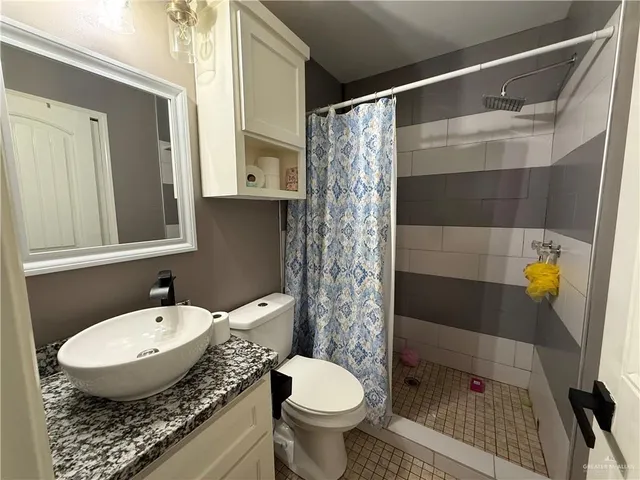 a kitchen with stainless steel appliances granite countertop a stove microwave and refrigerator