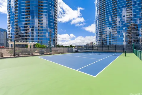 a view of a swimming pool with a back yard
