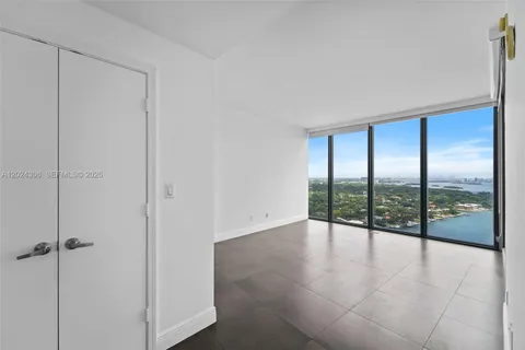 a view of an empty room and window