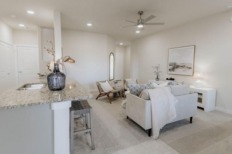 1104 Alexander Street Trenton, TX 75490 - Photo 7 of 18 Living room with ceiling fan, recessed lighting, and light colored carpet