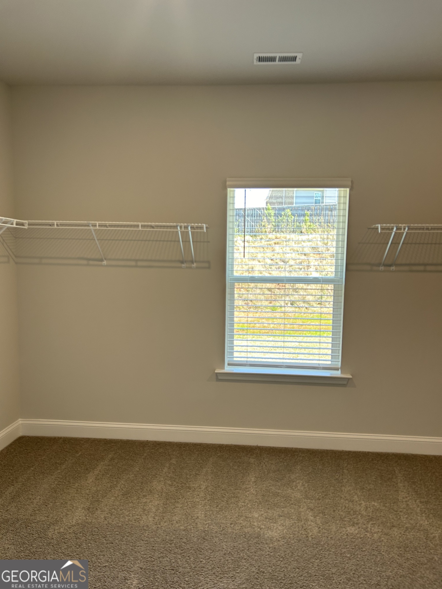 1402 Barrington Pl Way Macon, GA 31220 - Photo 5 of 12 a view of a small space with wooden floor and a window