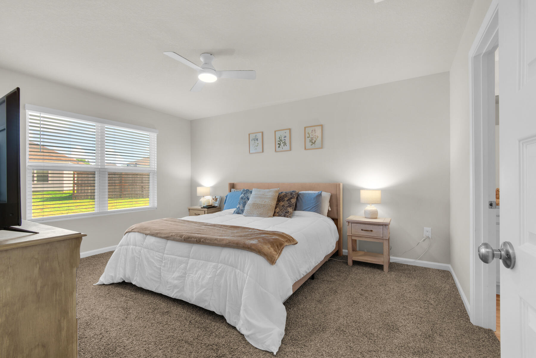 924 Sandbar Loop Crestview, FL 32539 - Photo 11 of 25 a spacious bedroom with a bed and glass windows