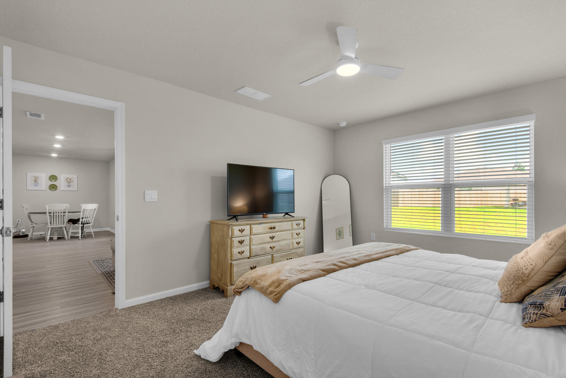 924 Sandbar Loop Crestview, FL 32539 - Photo 12 of 25 a bedroom with a bed and a flat screen tv