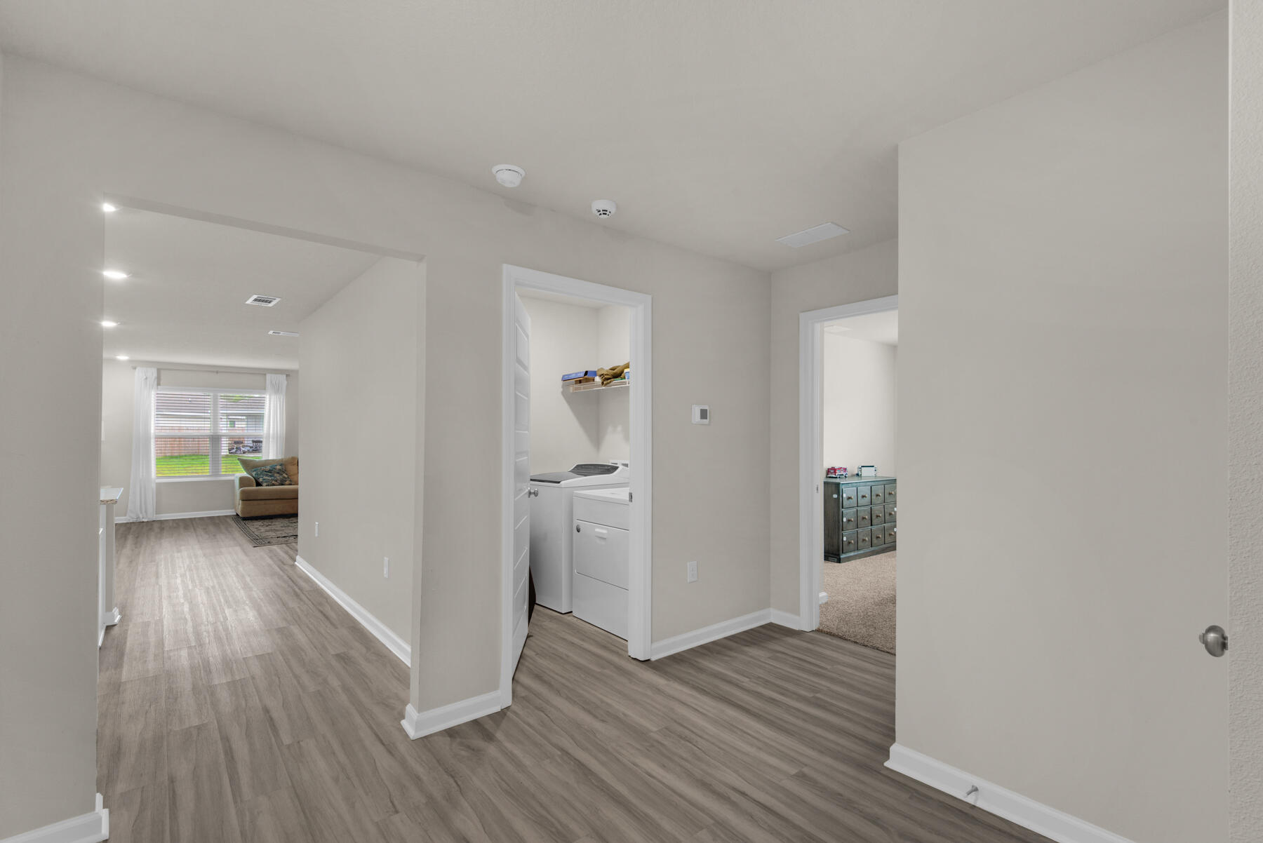 924 Sandbar Loop Crestview, FL 32539 - Photo 15 of 25 a view of a hallway with wooden floor